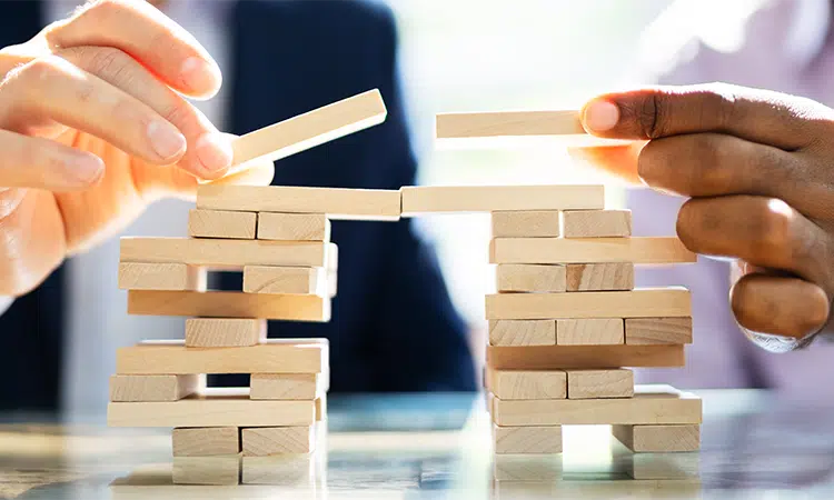 Professional networking two people stacking wooden blocks